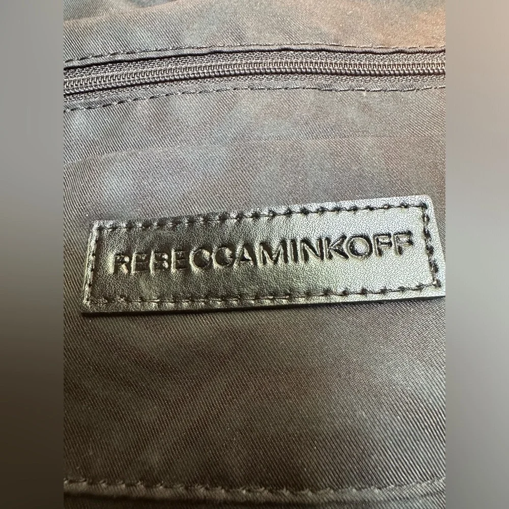 Rebecca Minkoff Moto hobo bag featuring prominent vertical zippers on the front.